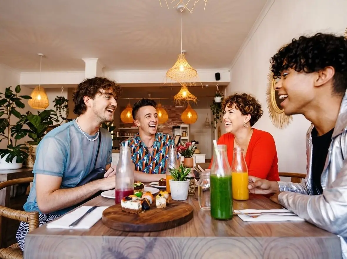 Friends sharing a meal together around a table