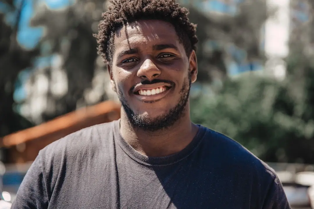 A man smiling outdoors